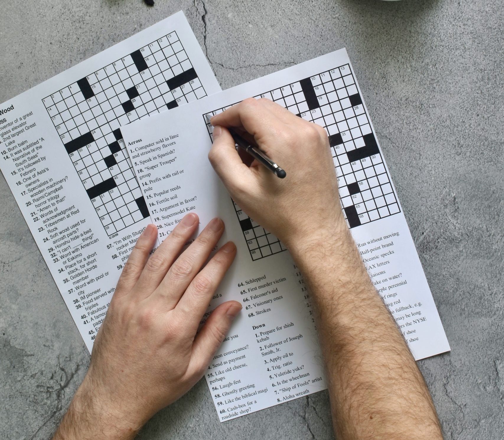 person doing a crossword puzzle 2024 12 03 09 52 29 utc scaled e1757605625308